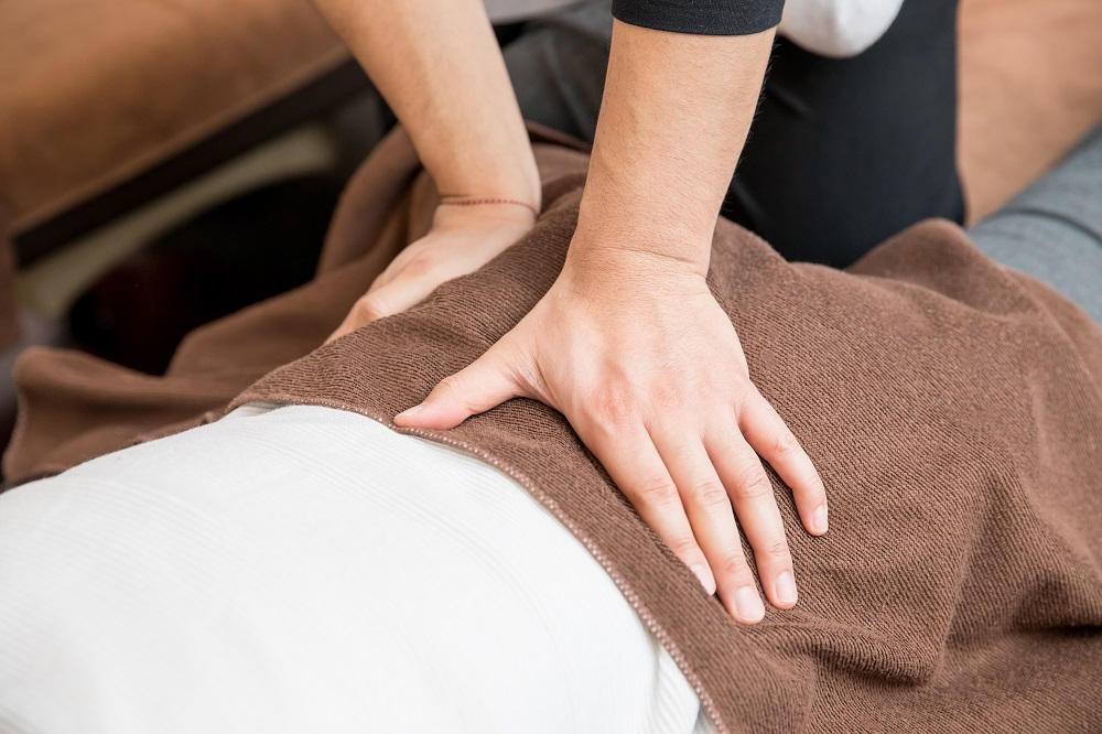 Woman receiving manual therapy in PT