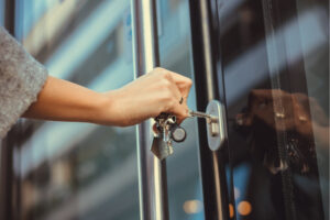 putting key in door