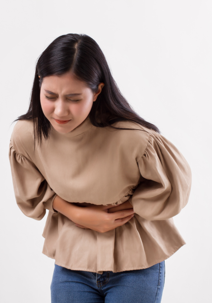 Woman having stomach cramps from taking fiber laxatives