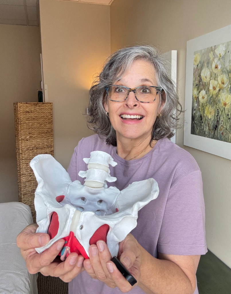 Holly-McDonald-PT-pic-7.webp Holly McDonald PT holding a model pelvis